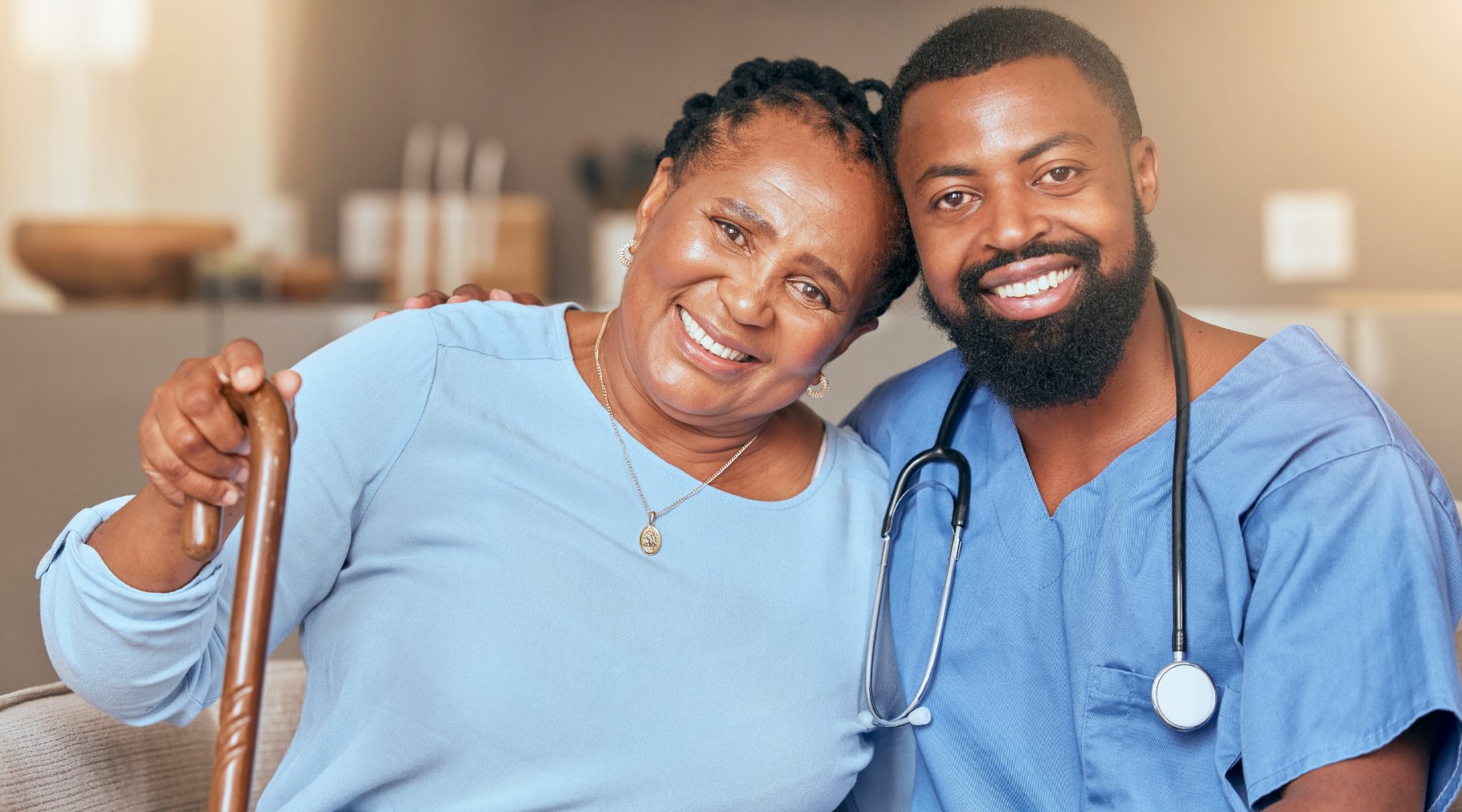 senior black woman and doctor or caregiver hugging for support